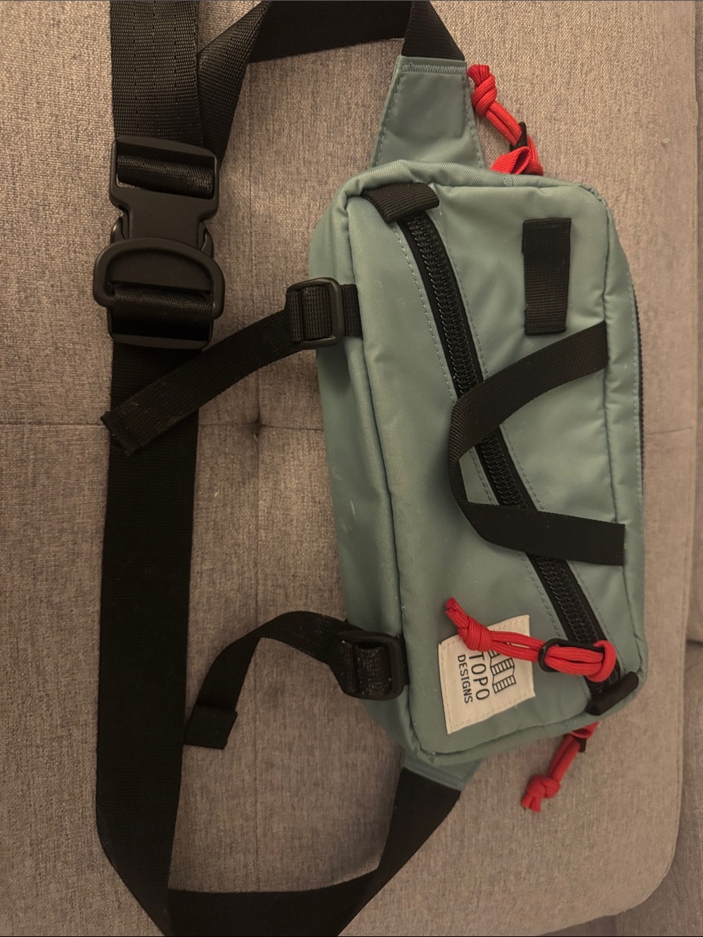 Topo Designs Sage Green Sling Bag with Black Strap and Red Accents - Picture 3 of 3